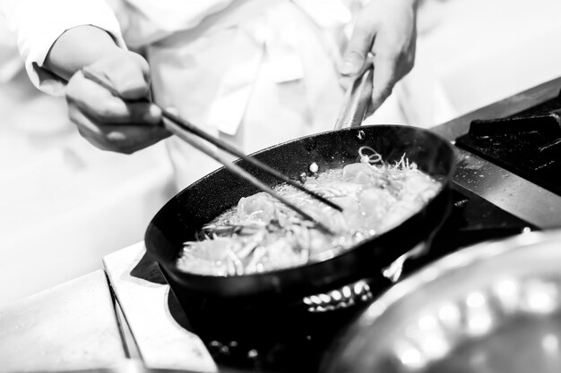 Chef preparing food in the kitchen, chef cooking	