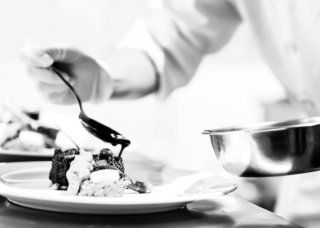 Photo chef preparing food in the kitchen, chef cooking