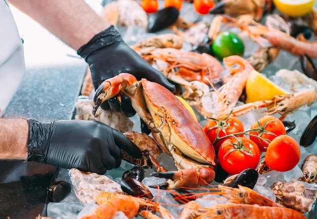 The Chef puts the seafood on a tray in the restaurant.