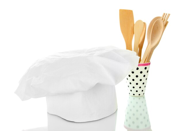 Chef's hoed met lepels op wit wordt geïsoleerd