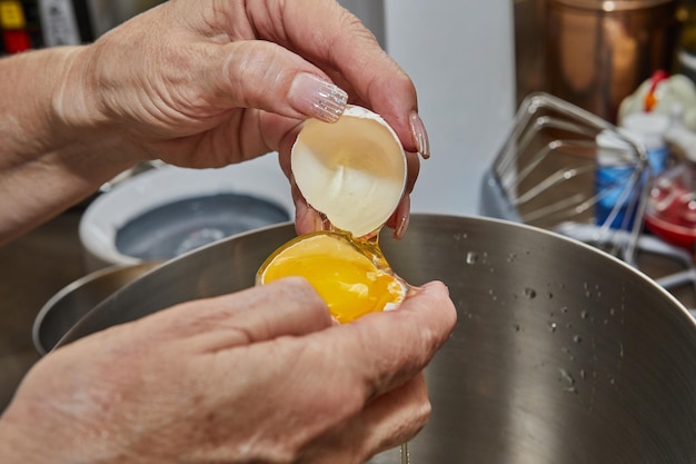 Chef separates the yolk from the protein to make the pie