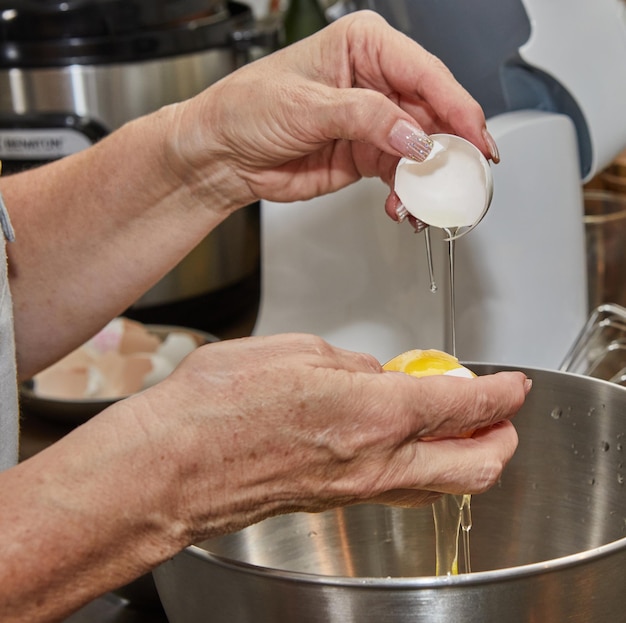 Chef separates the yolk from the protein to make the pie