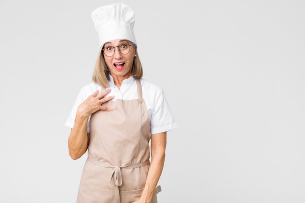 chef woman feeling shocked astonished