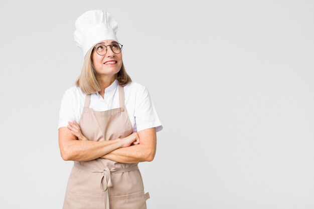 chef woman shrugging feeling confused and uncertain