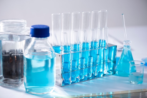 Photo chemical laboratory equipment glassware for research and blue matter