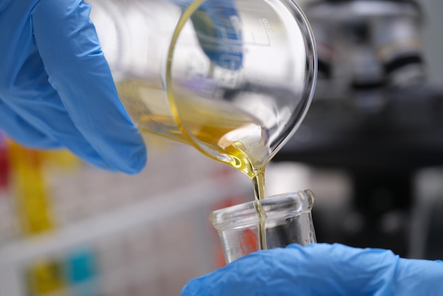 Photo chemical laboratory research and liquid oil processing closeup