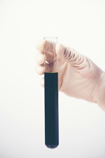 Chemical liquid in glassware of science lab on white background