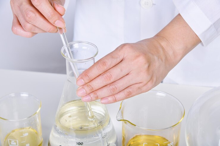 Chemical reagent pouring and mixing Laboratory and science experiments Formulating the chemical for medical research