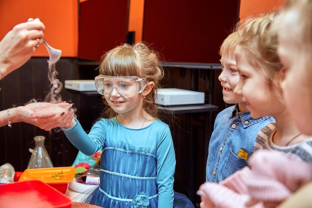 Chemical show for kids Professor carried out chemical experiments with liquid nitrogen on Birthday little girl