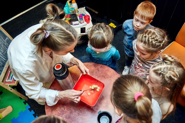 Chemical show for kids Professor carried out chemical experiments with liquid nitrogen on Birthday little girl