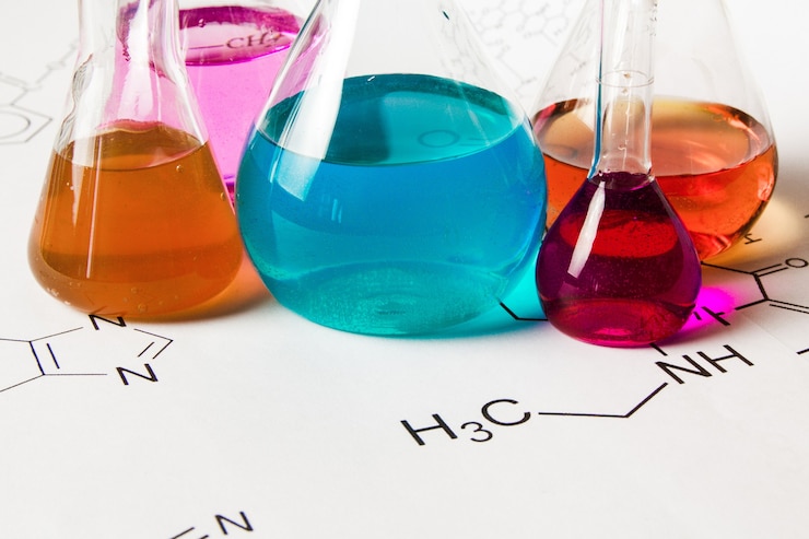 फोटो chemical tube with reaction formula background
