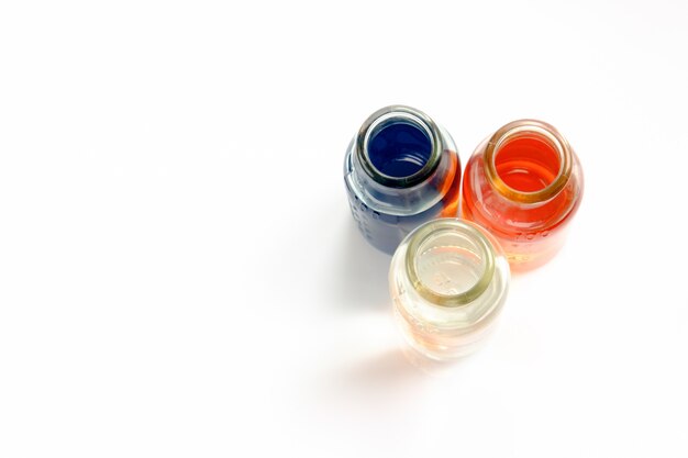 Chemical vessels with colorfull liquids on white background