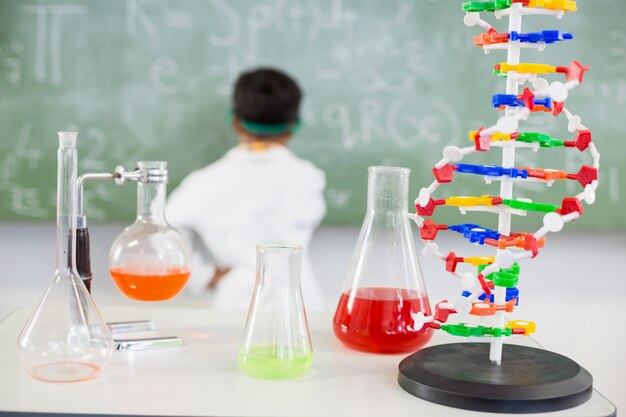 Chemicals beaker and flasks n table in laboratory