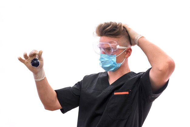 Chemist in protective uniform holding flask and test tube with minerals isolated on white. Science and experiment concept