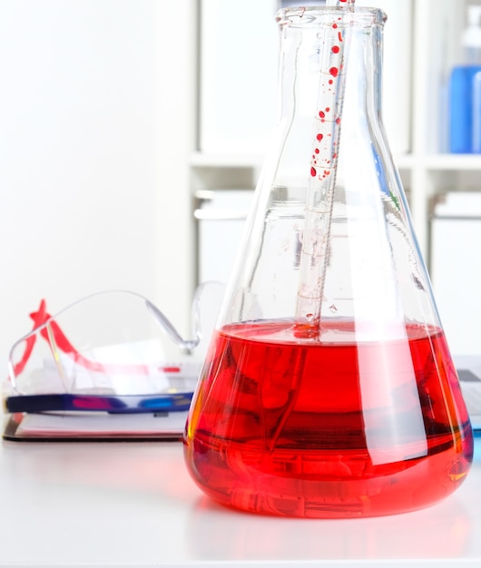 Chemist's desk in the laboratory. Scientist workplace in laboratory