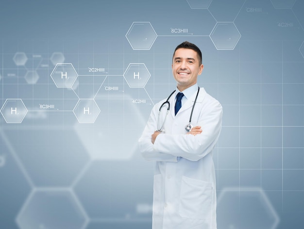 chemistry, biology, people and medicine concept - smiling male doctor in white coat over chemical molecule formula on gray background