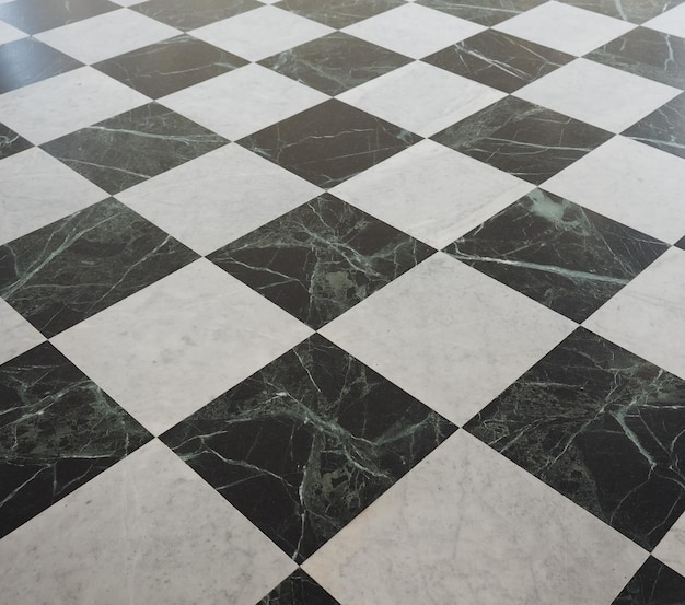 Chequered white green and black stone floor background