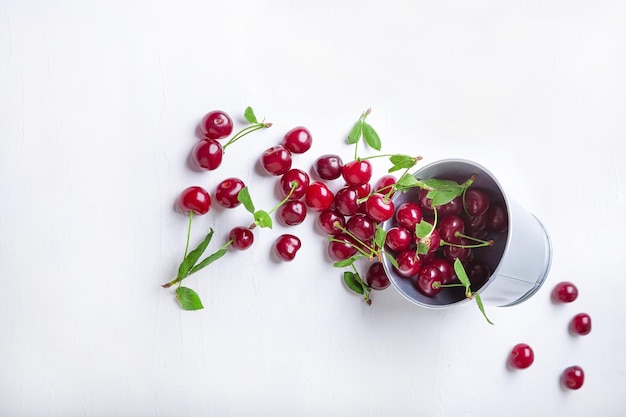 Cherries in a bucket on white background