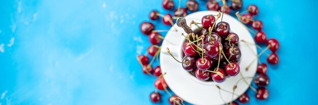 Cherries in a cup. panoramic banner with copy space