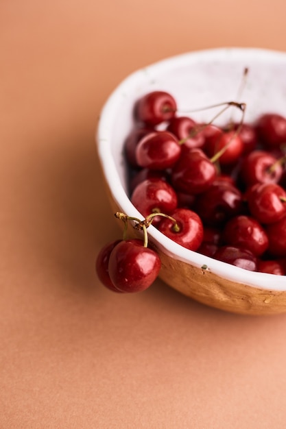 Cherries in handmade ceramic bowl