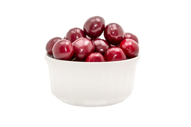 Cherries in white bowl isolated on white