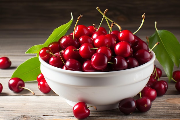 Cherries with leaves glisten in a white bowl on wooden backdrop