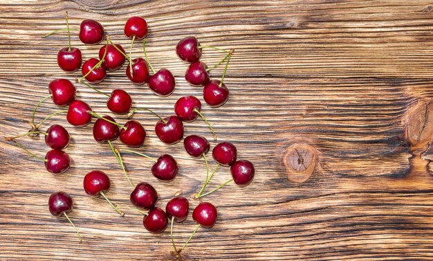 Cherries on the wooden background