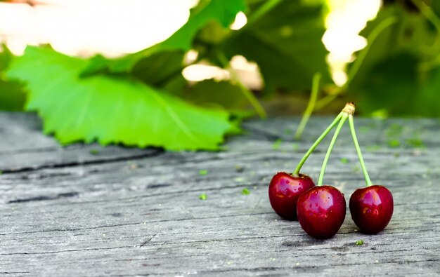 Cherries on wooden table