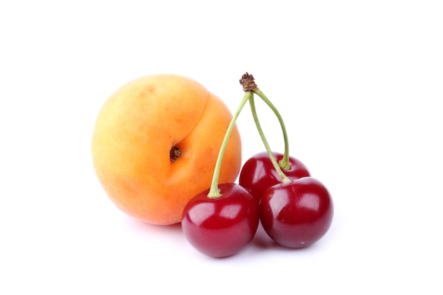 Cherry and apricot isolated on white background