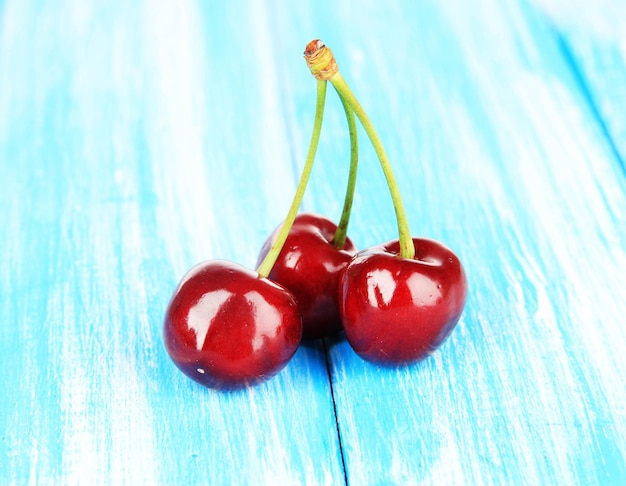 Cherry berries on wooden table closeup