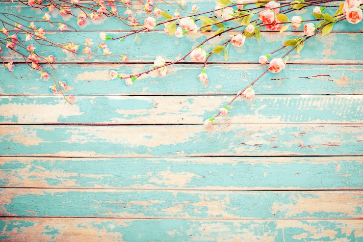 Photo cherry blossom flowers on vintage wooden background, border design