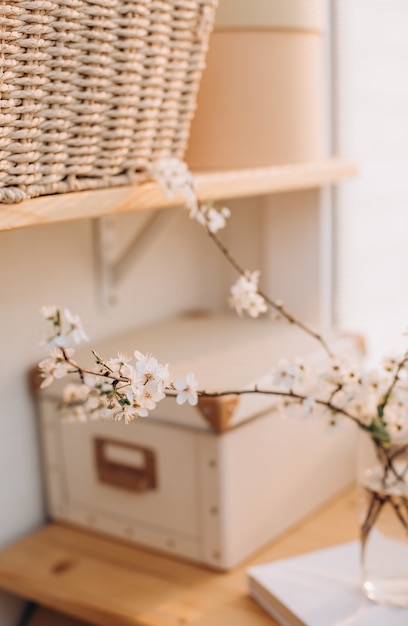 Cherry blossoms vase wicker basket table room