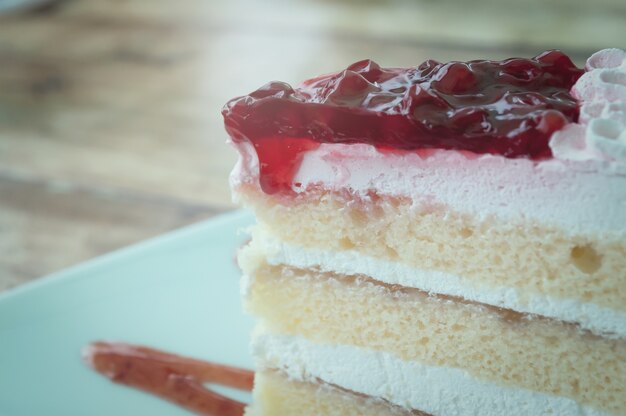 Cherry cake on old wooden desk