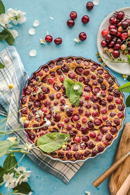 Cherry Clafoutis with cherry on a blue  background