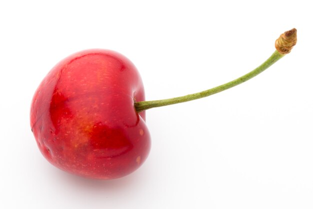 Cherry, fresh on a white surface.