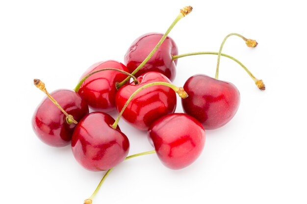 Cherry, fresh on a white surface.