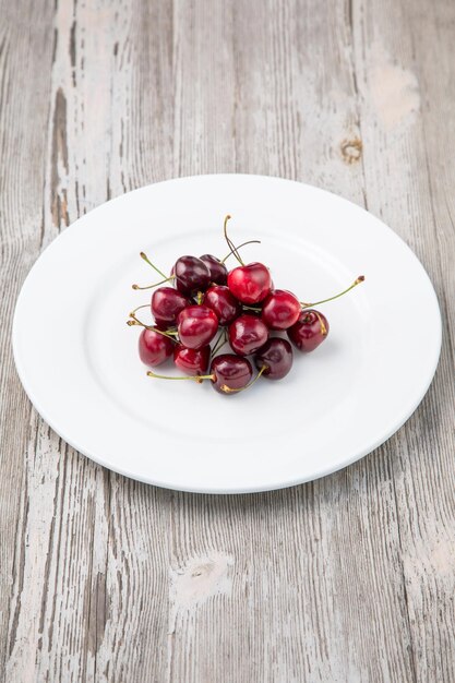 Cherry Fruit and white wooden background Fruit salad with strawberry blueberry sweet cherry