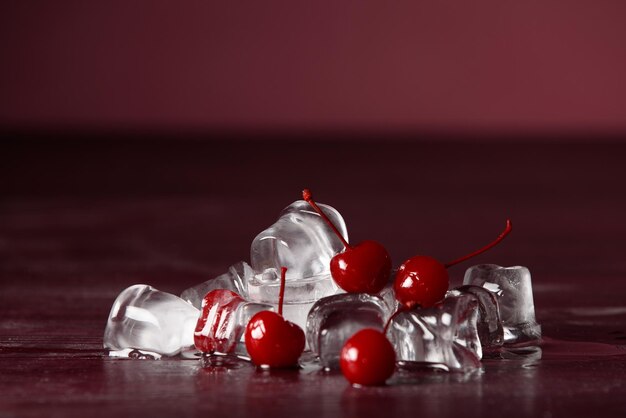 Cherry fruit with ice water drops on dark background closeup Cherry healthy summer berry