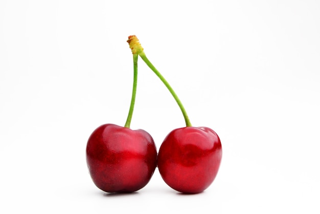 Cherry isolated Cherry on white Cherries With clipping path Red cherries on a white background full of vitamins and tasty flavor sweet and ideal for eating raw or in desserts