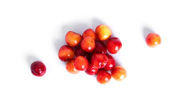 Cherry isolated on a white background. Sweet cherry berries on a white background. Red berries are isolated. Yellow cherry. High quality photo