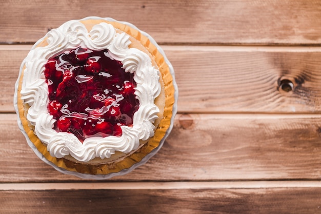 cherry jam cake on wooden table