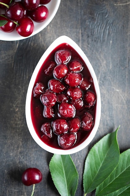 Cherry jam and fresh cherries in a bowl homemade preserves