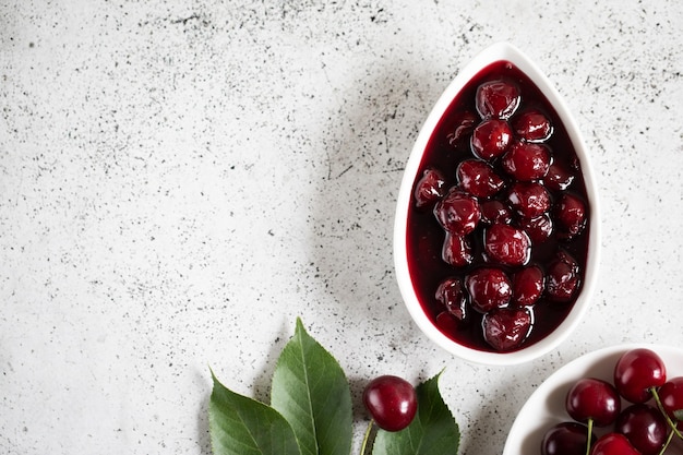 Cherry jam and fresh cherries in a bowl homemade preserves