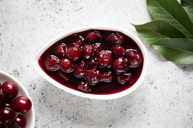 Cherry jam and fresh cherries in a bowl homemade preserves