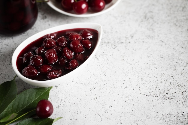 Cherry jam and fresh cherries in a bowl homemade preserves