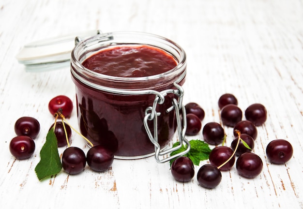 Cherry jam with fresh berries