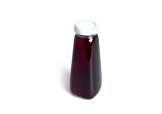 Cherry juice in bottle isolated on a white background. . High quality photo