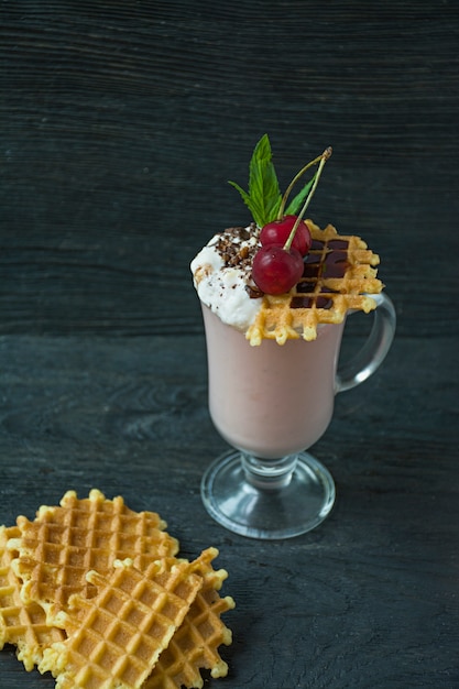 Photo cherry milkshake with ice cream and whipped cream