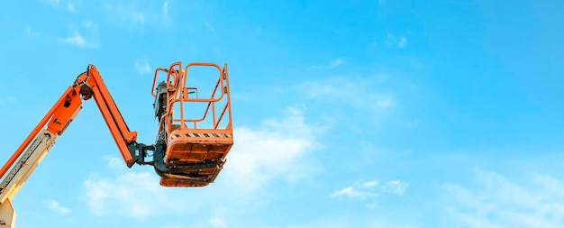 Cherry picker with blue sky