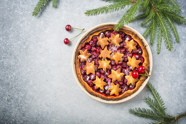 Cherry piecake with fresh cherry. Christmas decotation.